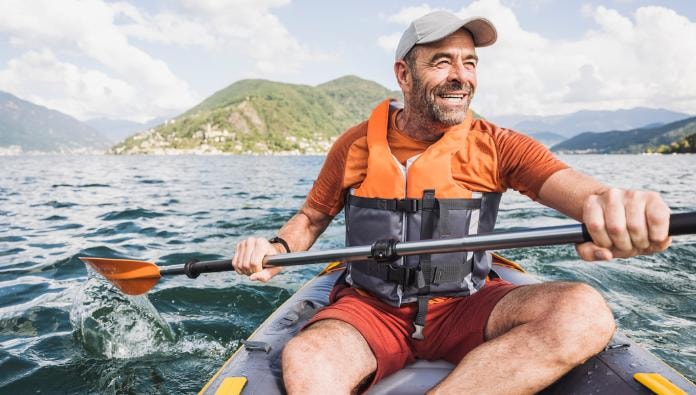 Man kayaking on a lake